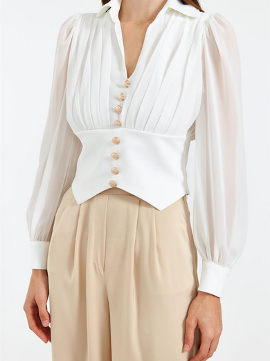 Blouse with gold buttons