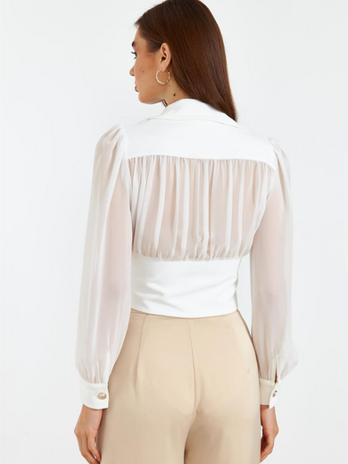 Blouse with gold buttons