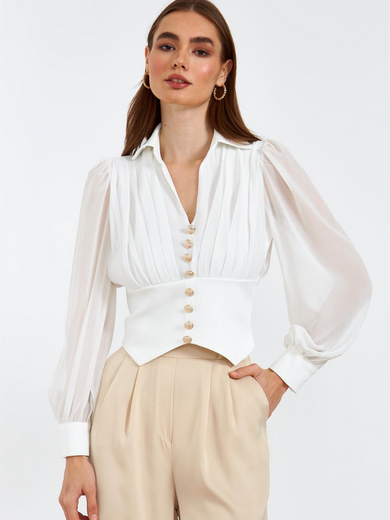 Blouse with gold buttons